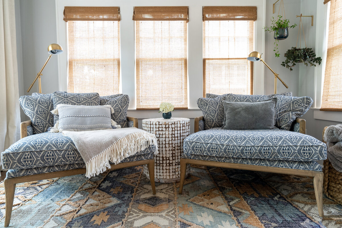 two oversized chairs with a blue and white pattern