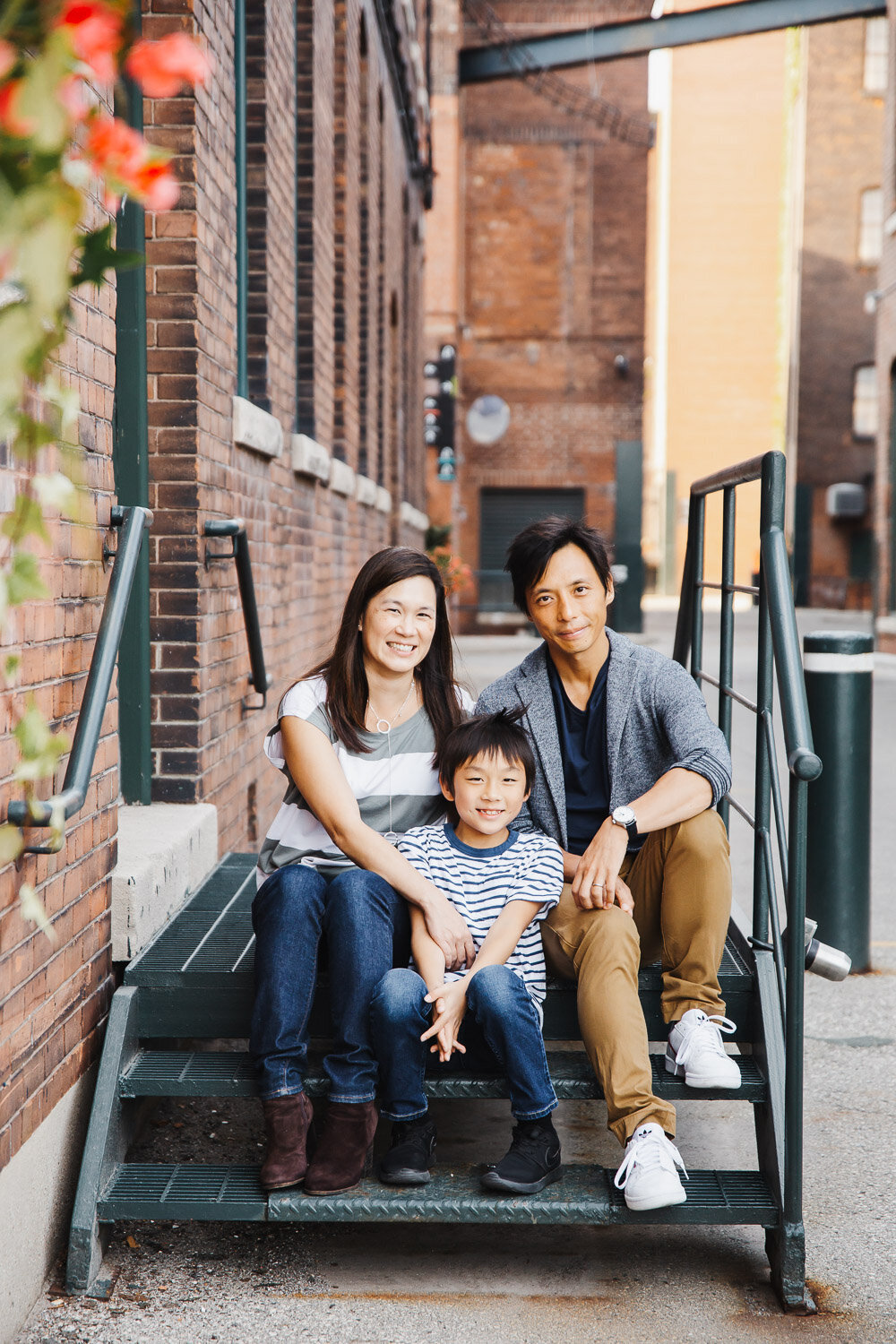 Parents and Son sitting on steps during family photography session