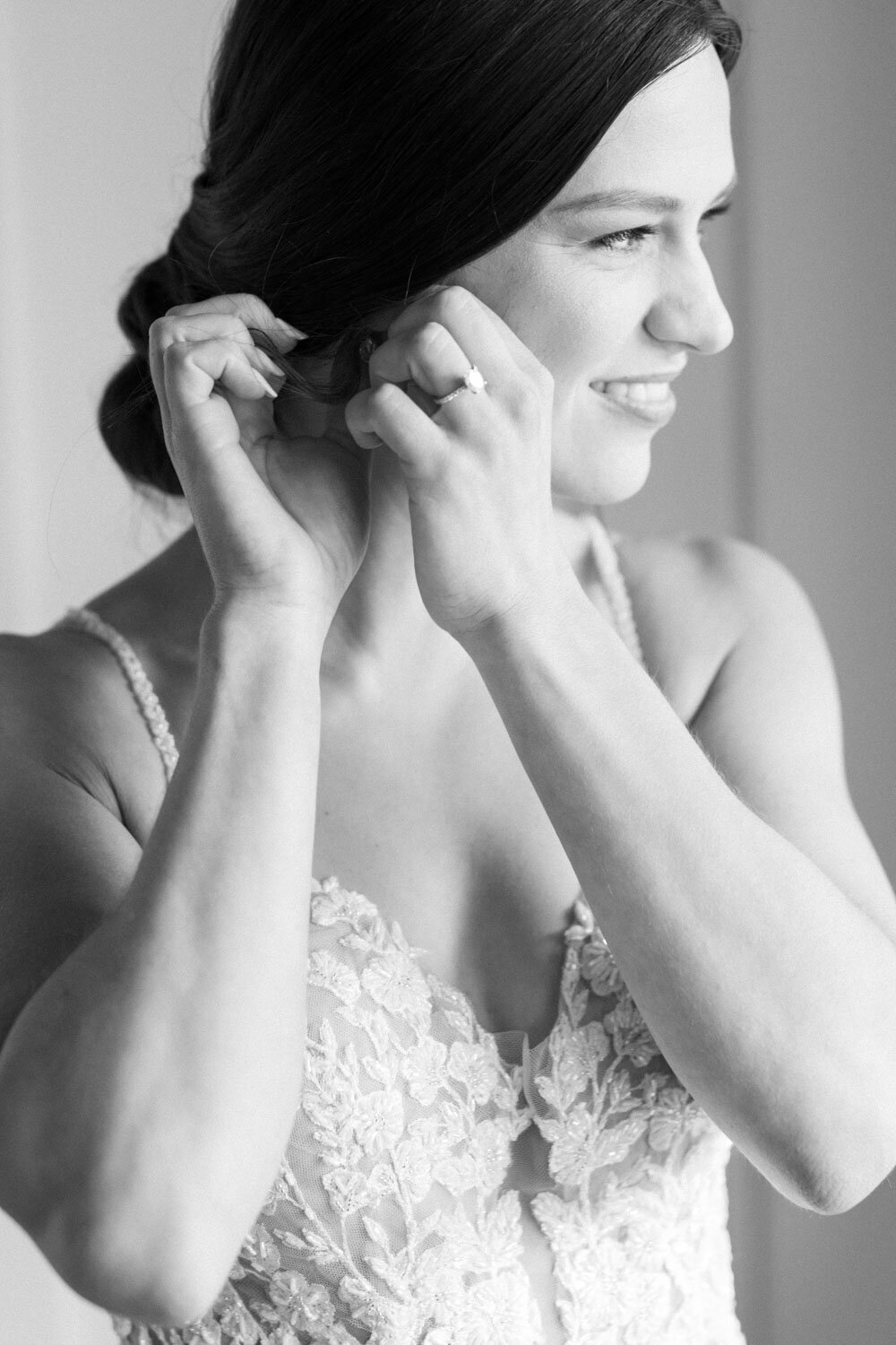 Bride wearing her earrings for the wedding