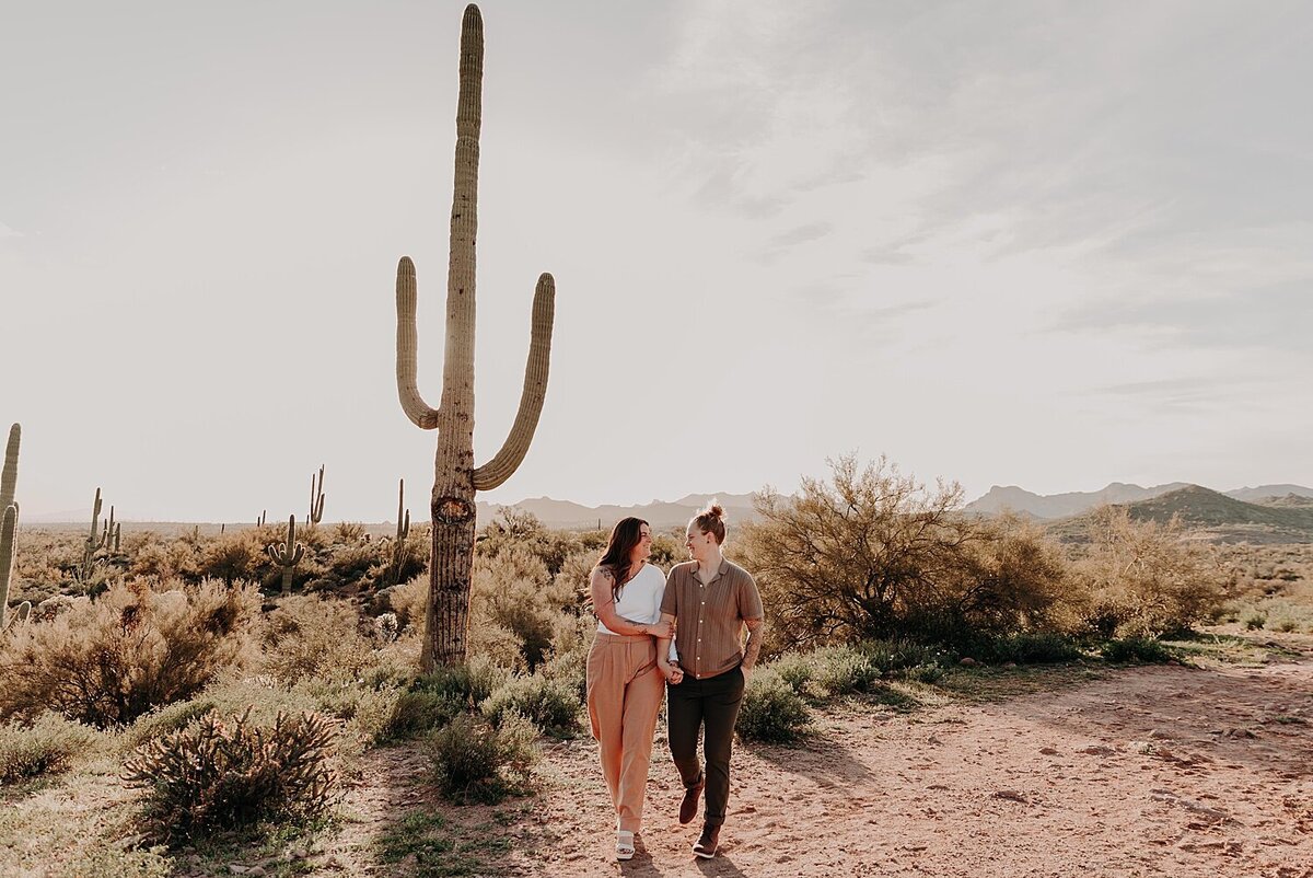 Two women walk together in the desert