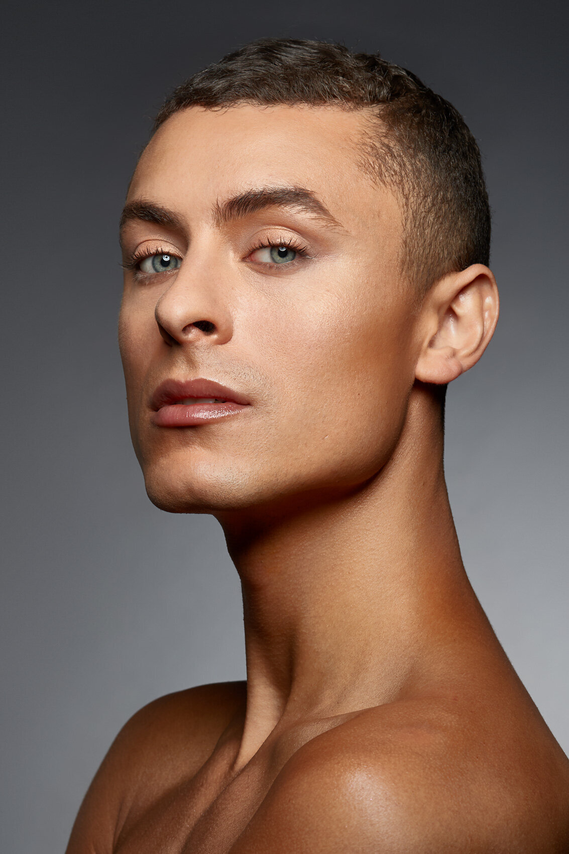 Profile portrait of Cory showcasing strong features and a neutral expression, captured by Ylva Erevall.