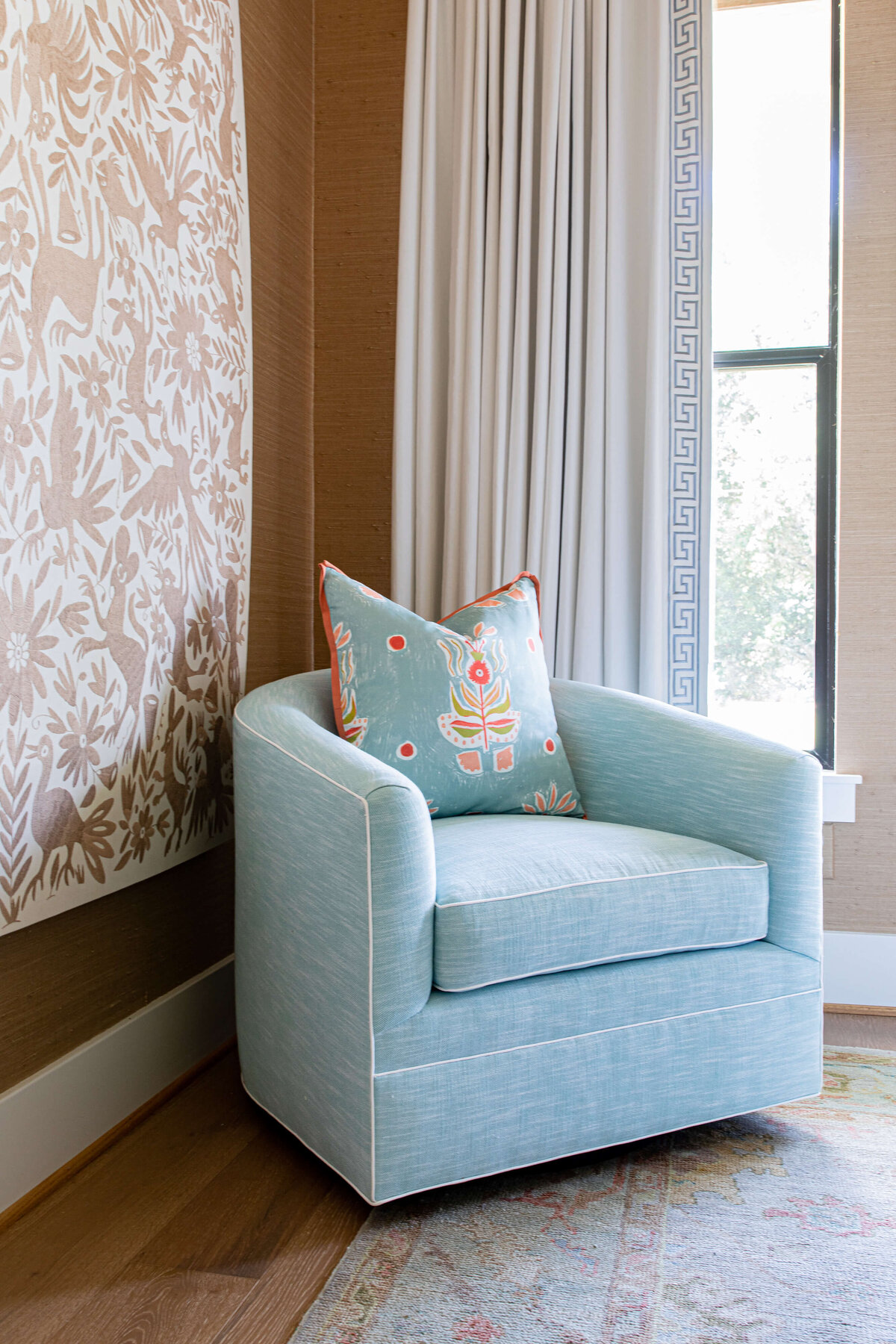 oyster creek studios aryns room light blue chair and decorative painting in bedroom