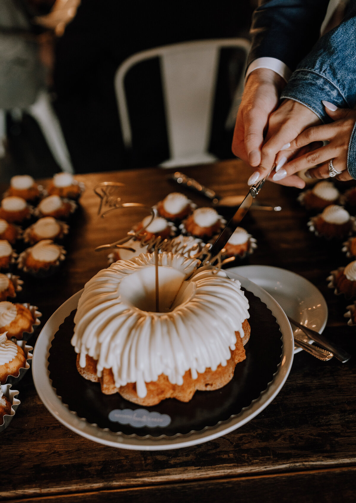 bride and groom cutting nothing bundt cake