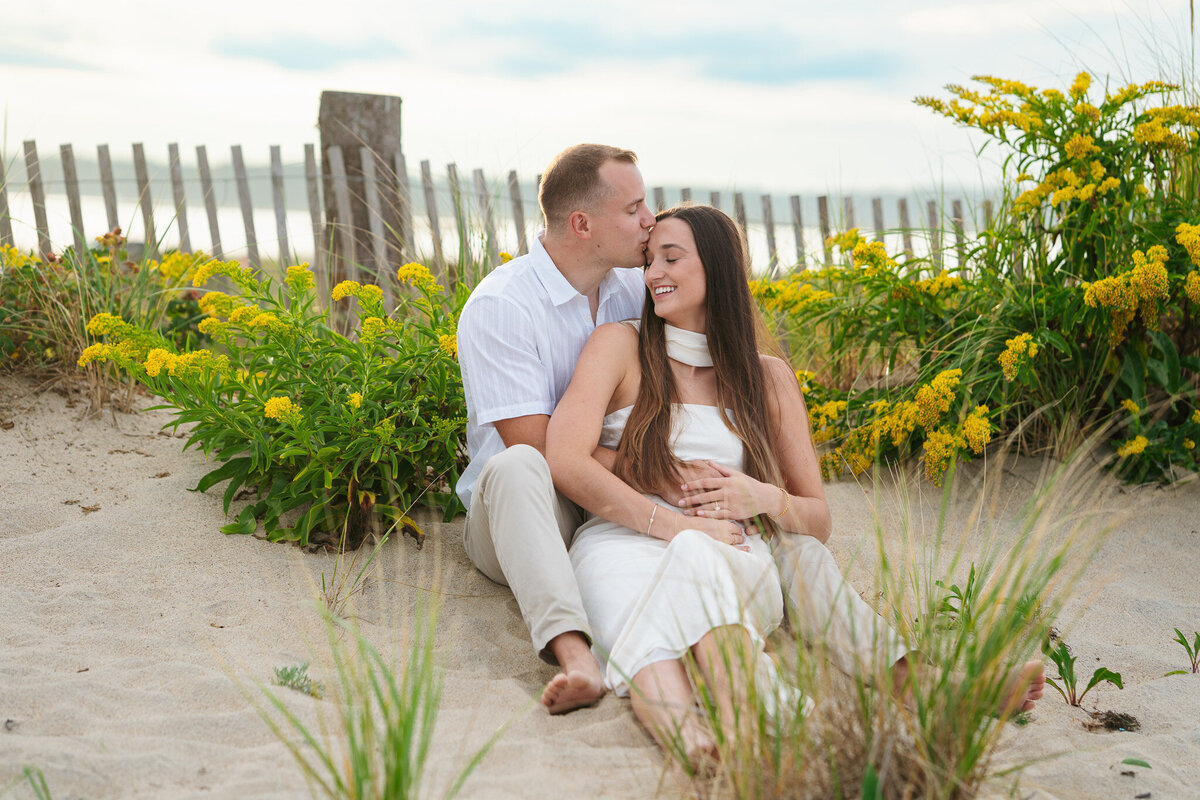 Romantic coastal engagement session in New England overlooking the shoreline.