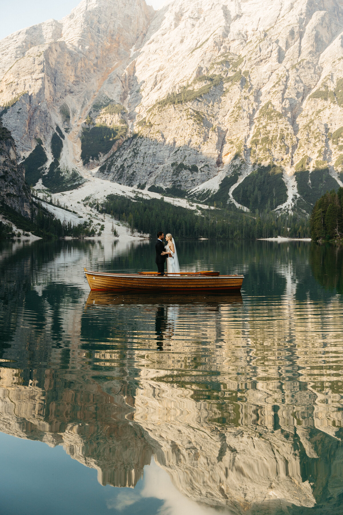 Scenic view of Lago di Braies docks surrounded by mountains