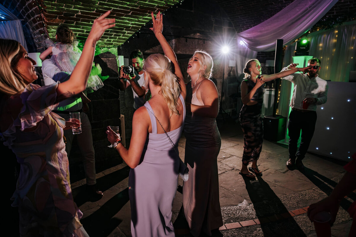 A group of people dancing at a party