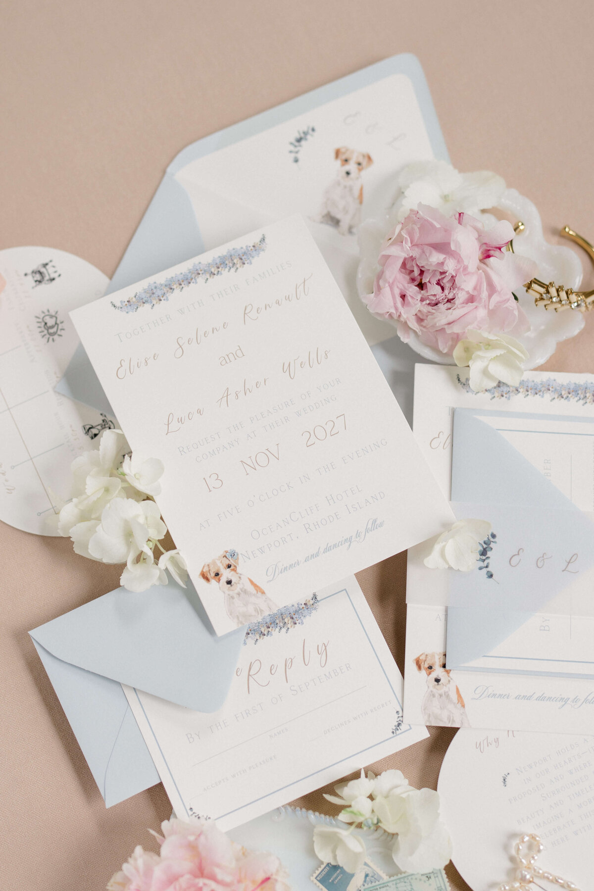 Custom coastal wedding invitation suite with delicate florals, classic typography, and a watercolor dog illustration by White Heart Design.