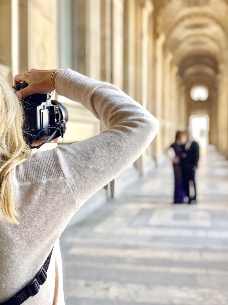Photographer Cari Long takes photo of couple during Paris anniversary photography session