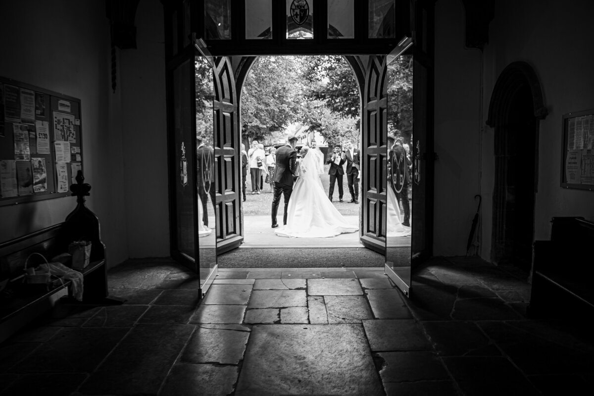 Black and white image of Bride and Groom at Church