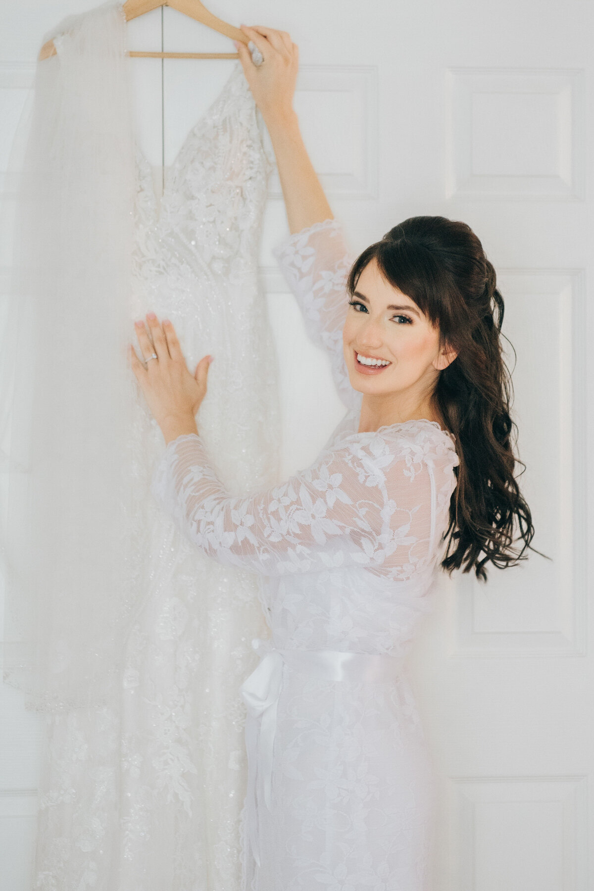 A bride posing with her wedding gown