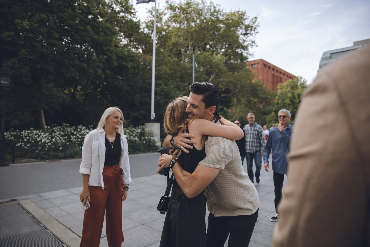 Hug and happy tears right after saying "yes" at the park.
