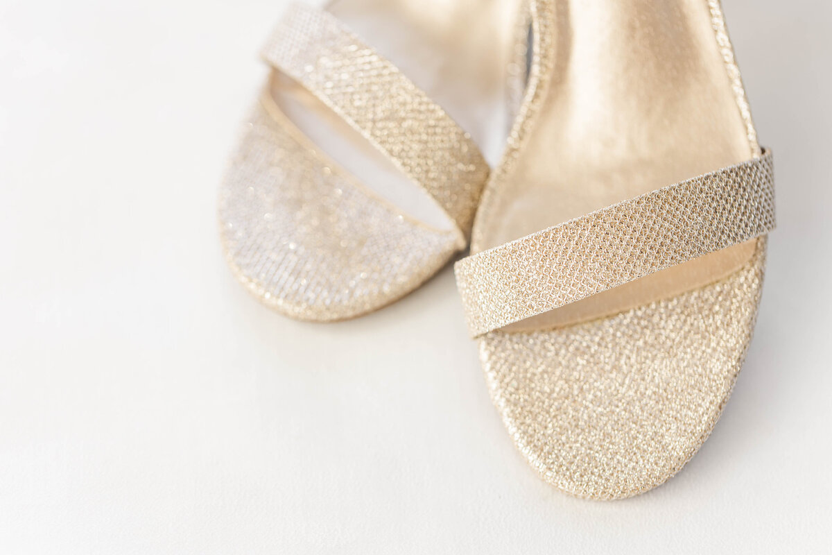 Close up of brides gold and sparkly wedding day heels by Kansas City Wedding Photographer Sarah Riner Photography