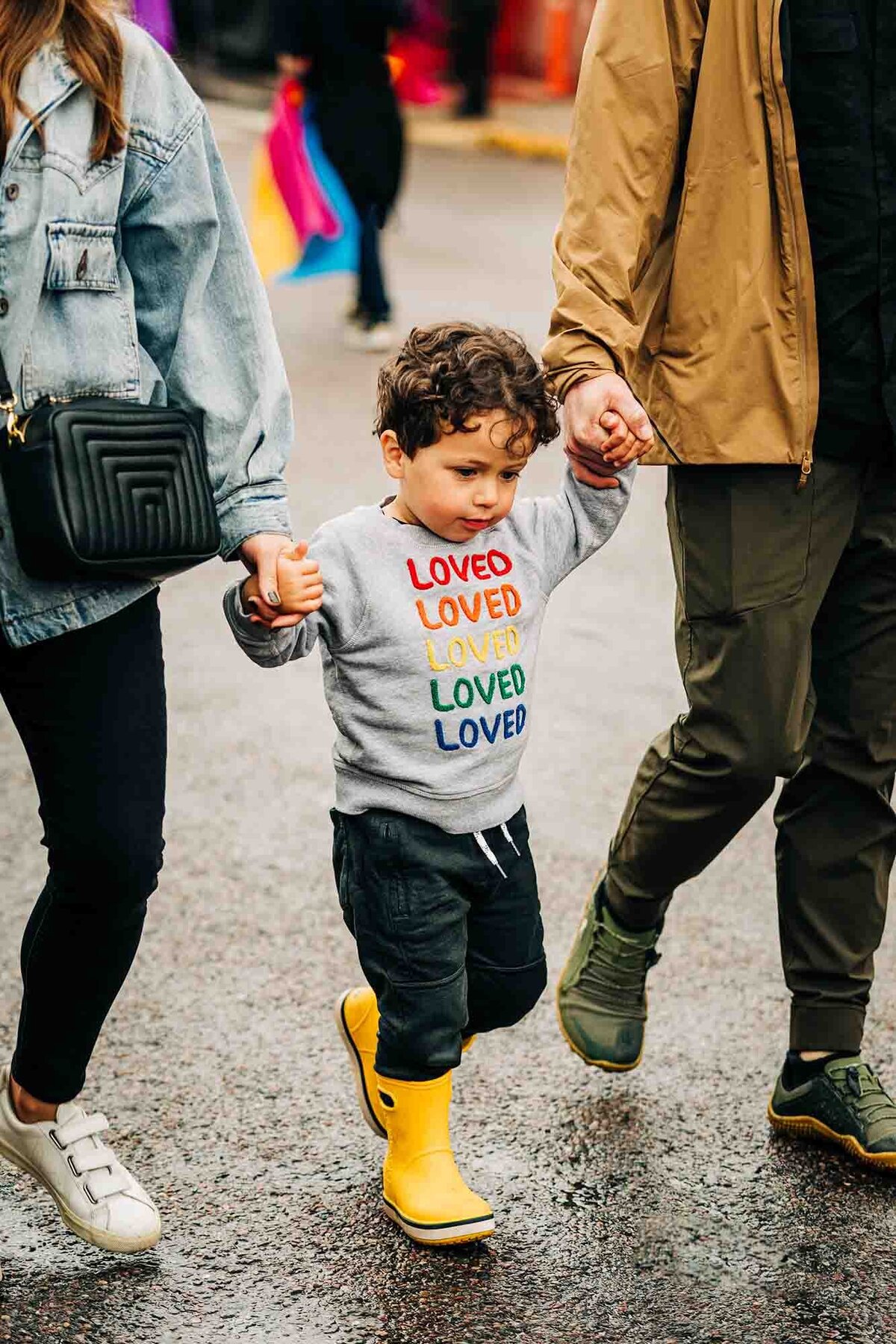 Little boy in yellow boots at Missoula gay pride festival