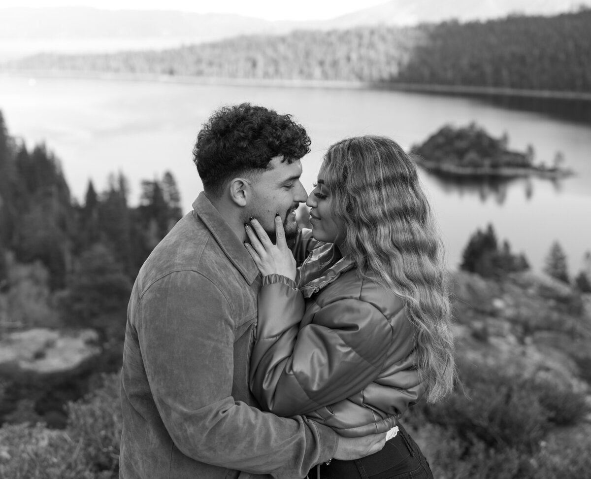 Couple gazing into the sunset during their engagement photo shoot at Lake Tahoe, surrounded by breathtaking scenery.