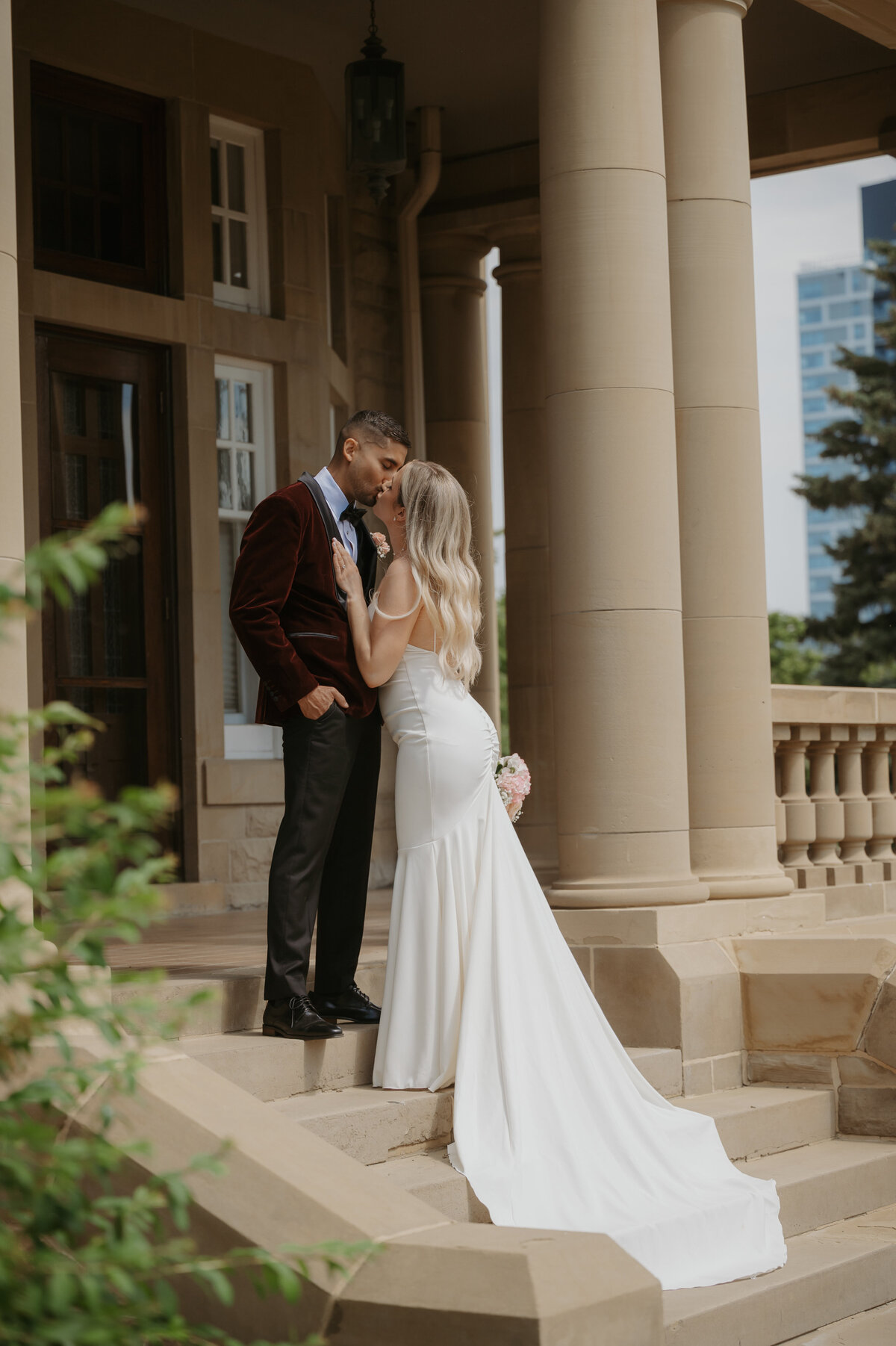 bride and groom at goverment house steps