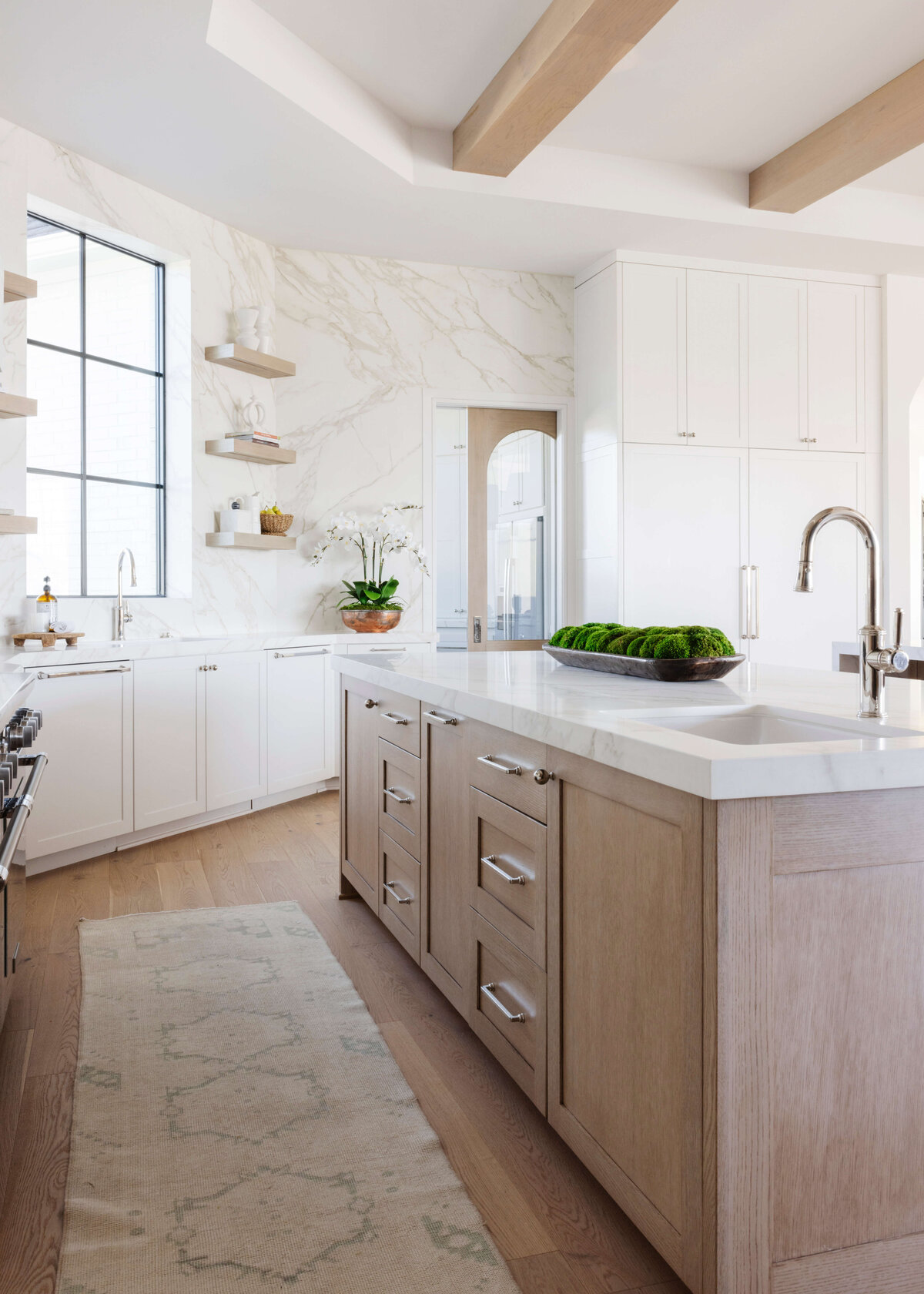 oyster creek studios hughes marble walls countertops runner rug in kitchen