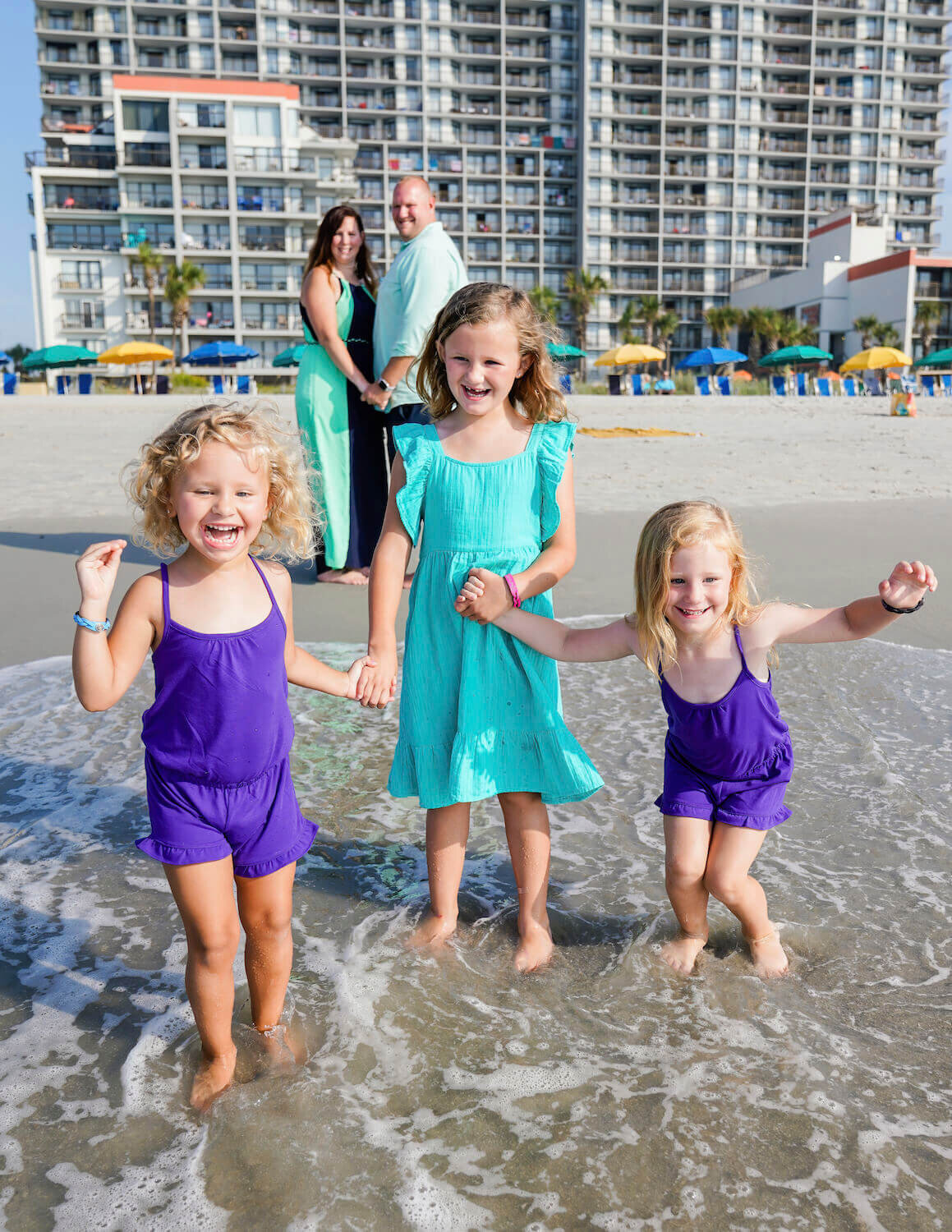 myrtle beach family photography - family of five smiling in water