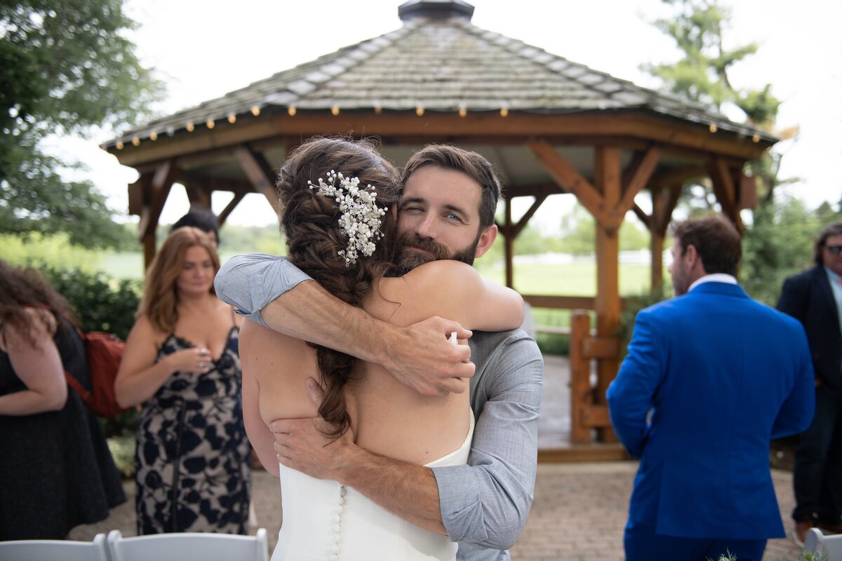 Candid hugs between wedding guests