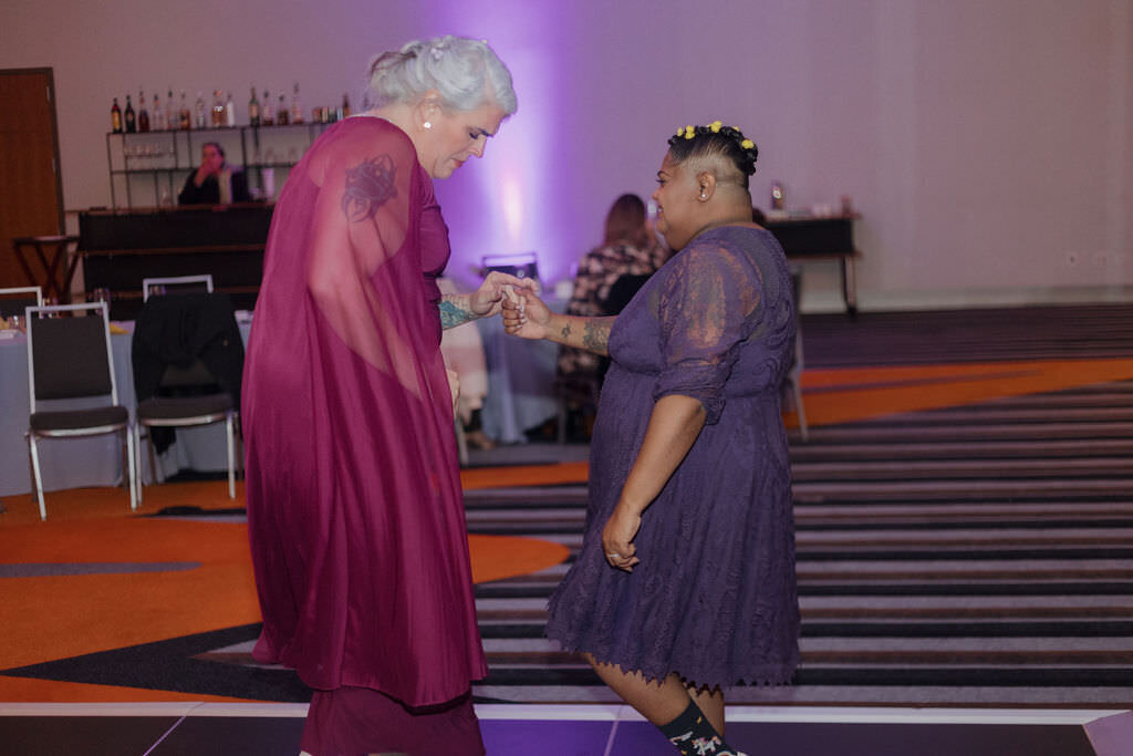 A couple dancing together at a wedding reception.