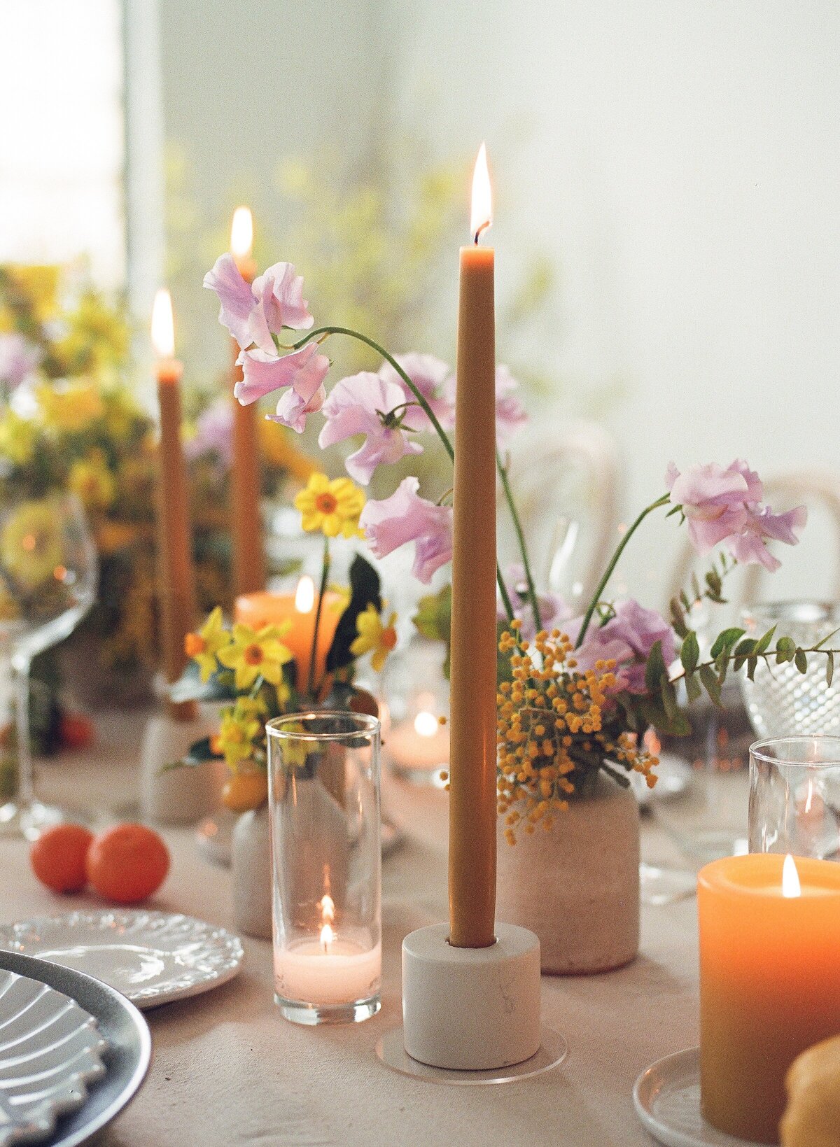 Burnt orange tapper candles with pink and yellow florals