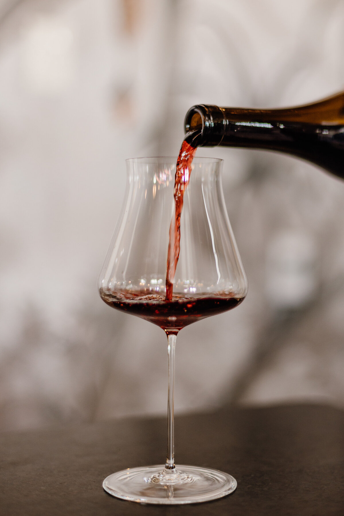 Wine being poured into a glass