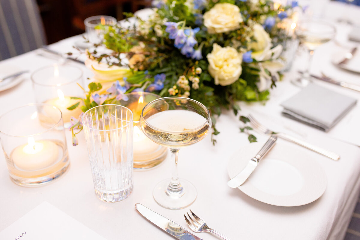 Champagne flute and floral centerpiece details  at the Spicer Mansion in Mystic, CT.