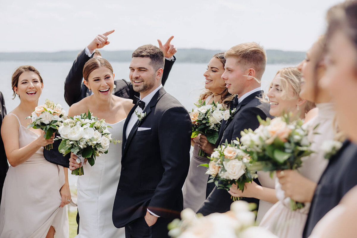Bride and groom surrounded by guests at Canandaigua Country Club, NY