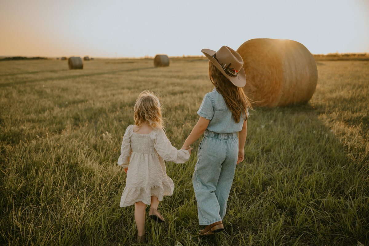 two sisters walking away in a Olympia Family Photography photoshoot