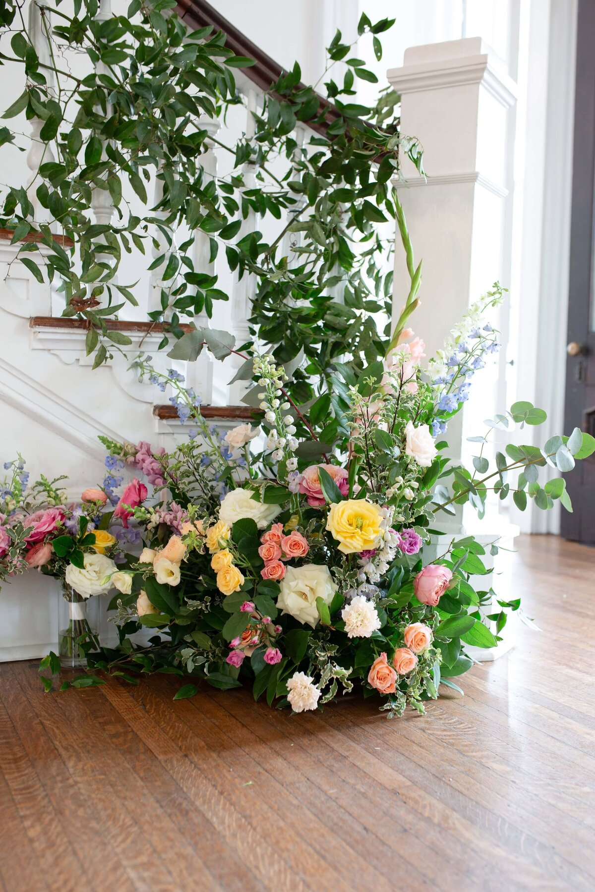 Colorful florals decorating the staircase at  Merrimon-Wynne House 