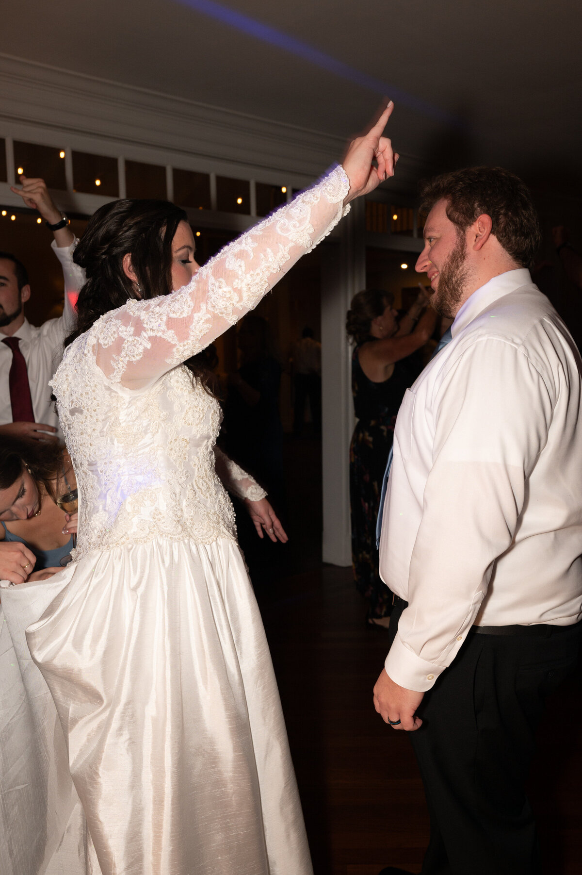 A newlywed couple dancing at their reception
