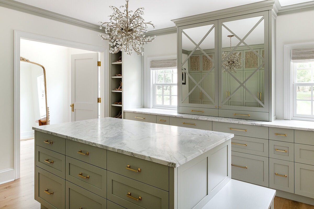 light gray closet room with large marble island