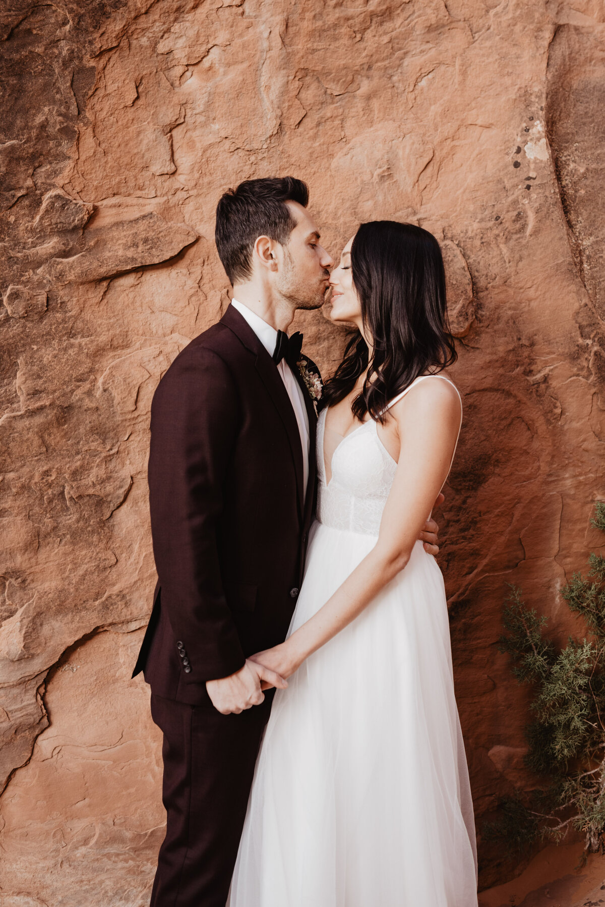 Utah elopement photographer captures groom kissing bride on nose