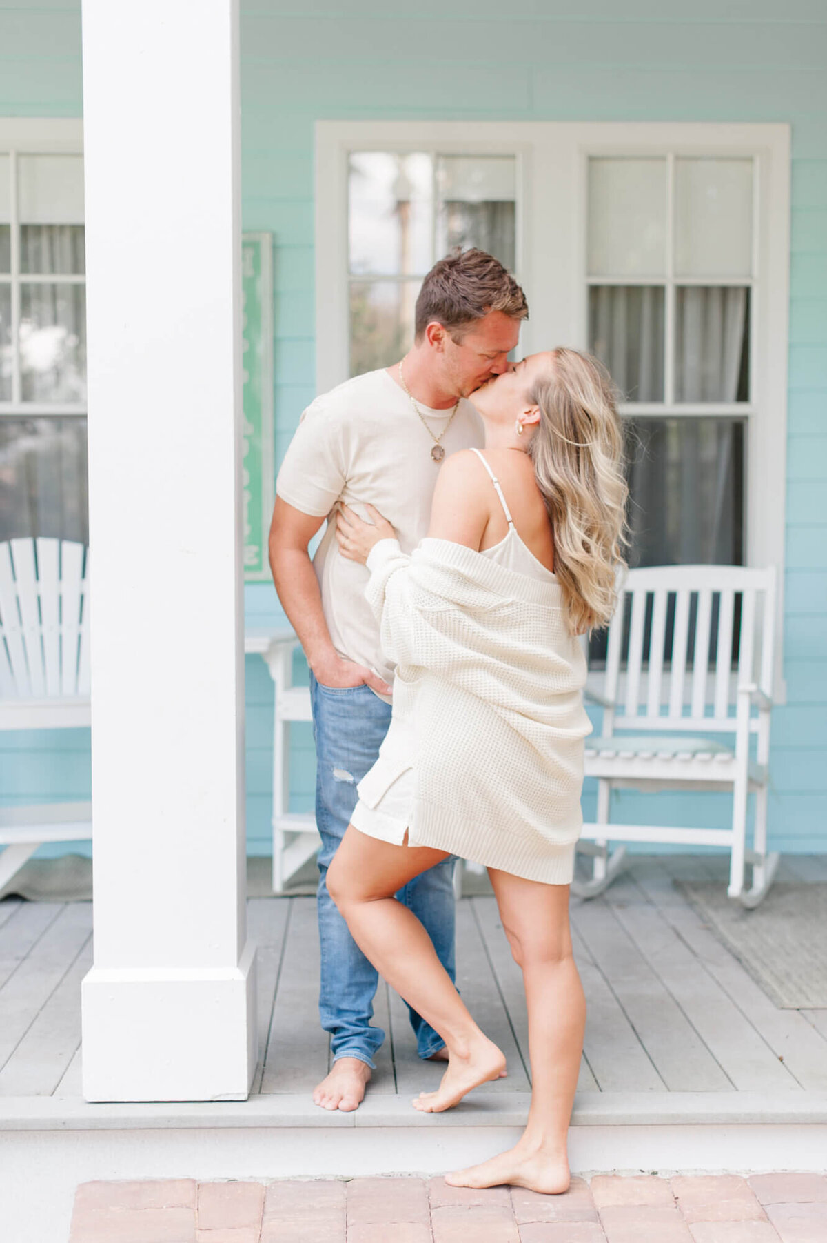 Orlando florida couple kisses during their family photography session at their coastal Florida home.
