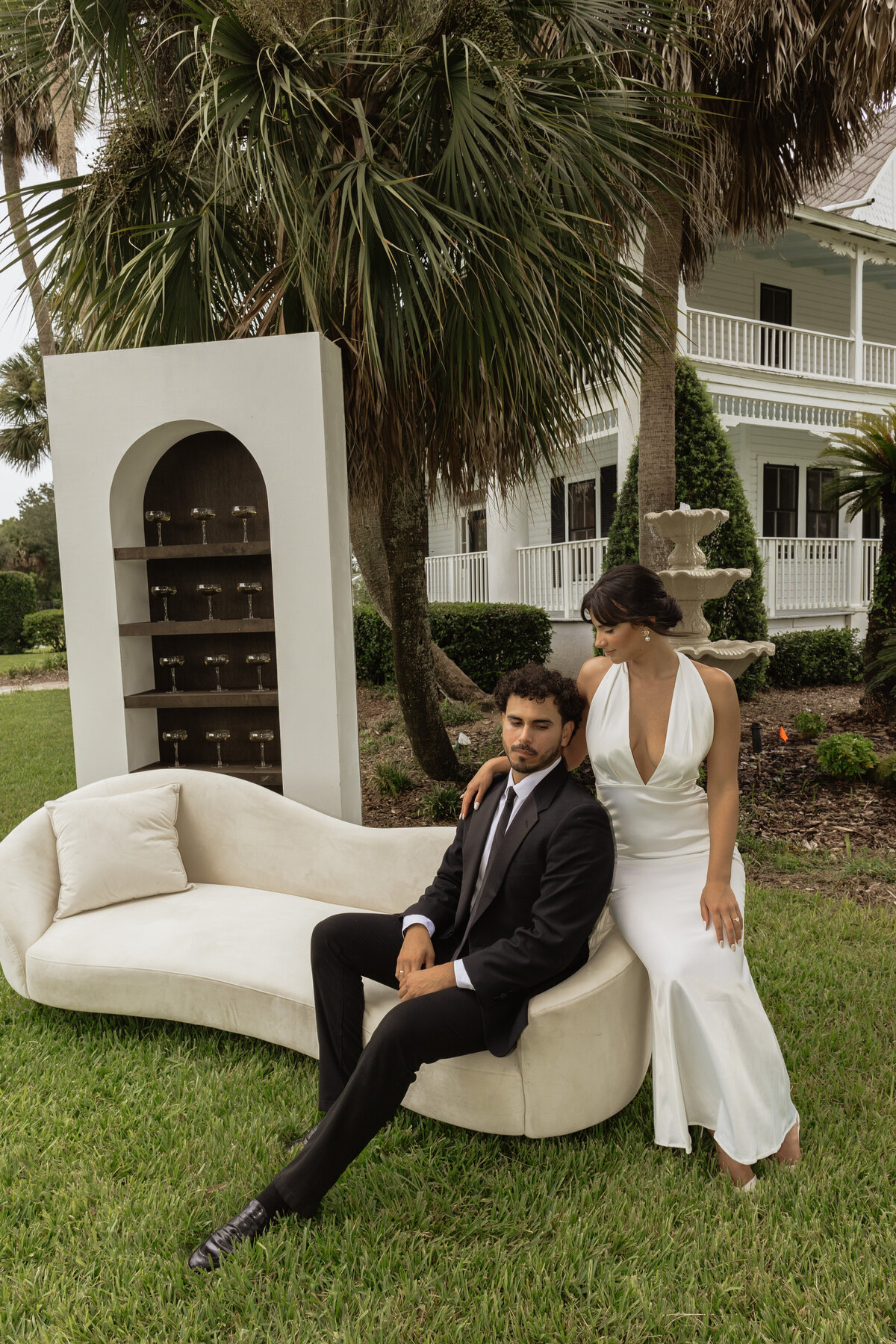 Champagne shelf display with gold accents at a luxury backyard wedding in Umatilla, Florida