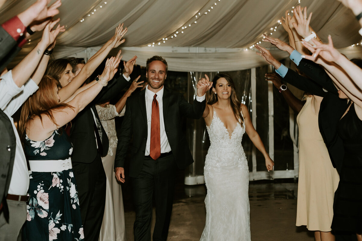 Bride and groom during their grand exit from their wedding reception at Cherokee Ranch and Castle.