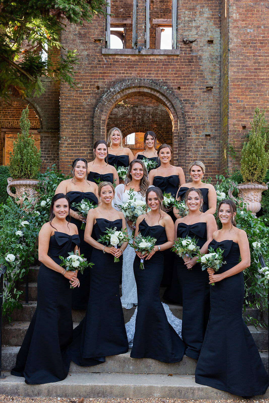 a bride posing for a photo with her bridesmaids