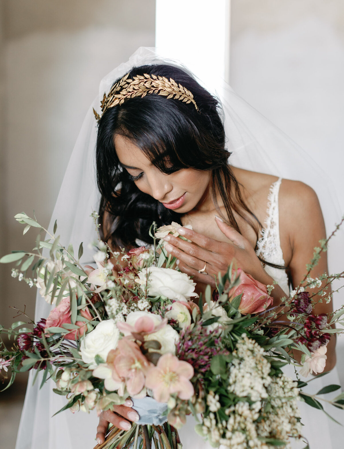Indian bride, colorful bouquet, gold headpiece
