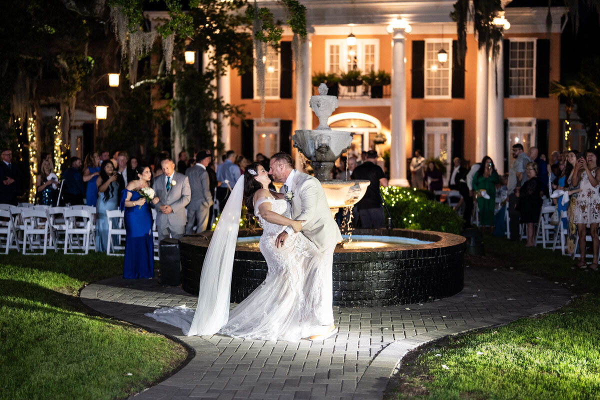 Bride and groom kiss at end of Southern Oaks wedding ceremony