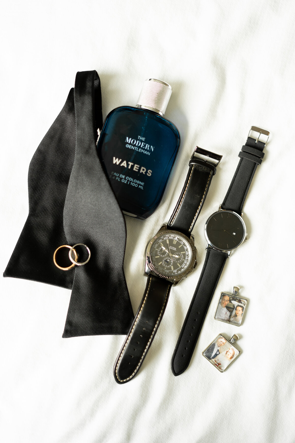 editorial details of the groom including rings, cologne, watches getting ready for wedding Oberlin, Ohio