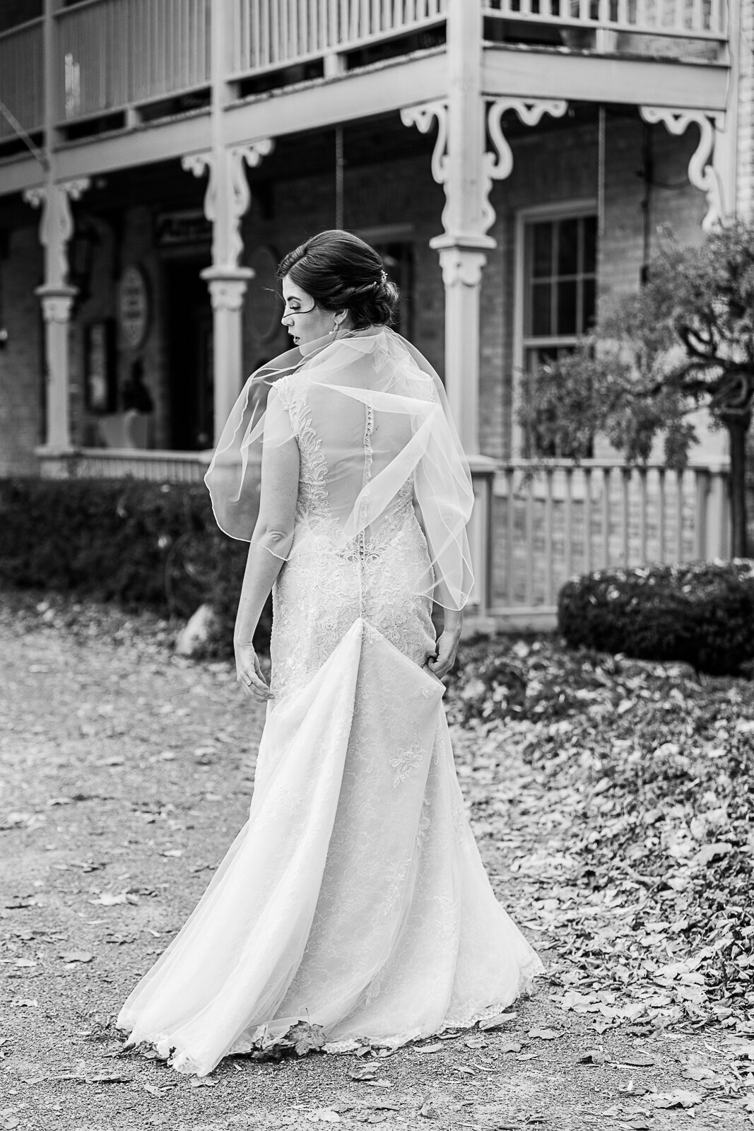 black and white photo of back of a bride