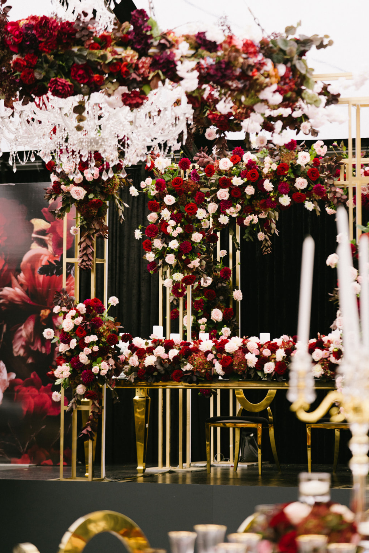 black-gold-burgundy-red-tent-reception-chandeliers-roses-sweet-heart-table