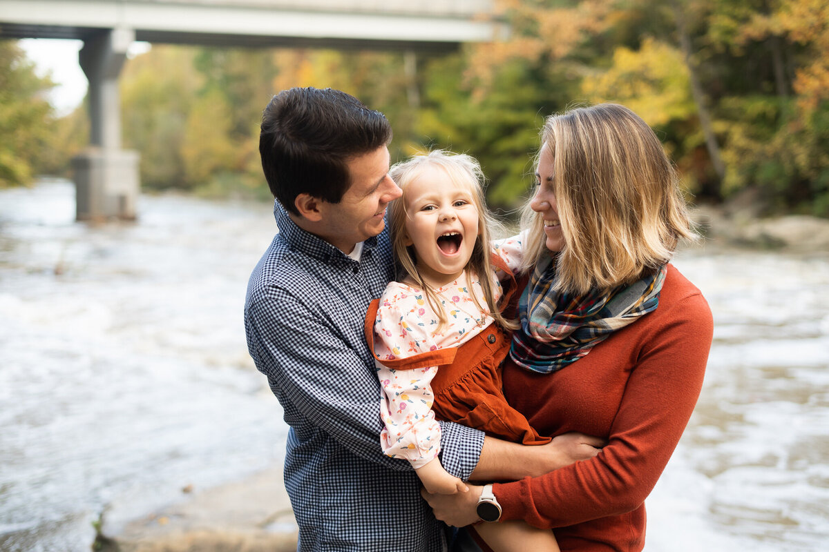 family hugging during candid fall photo session Cleveland