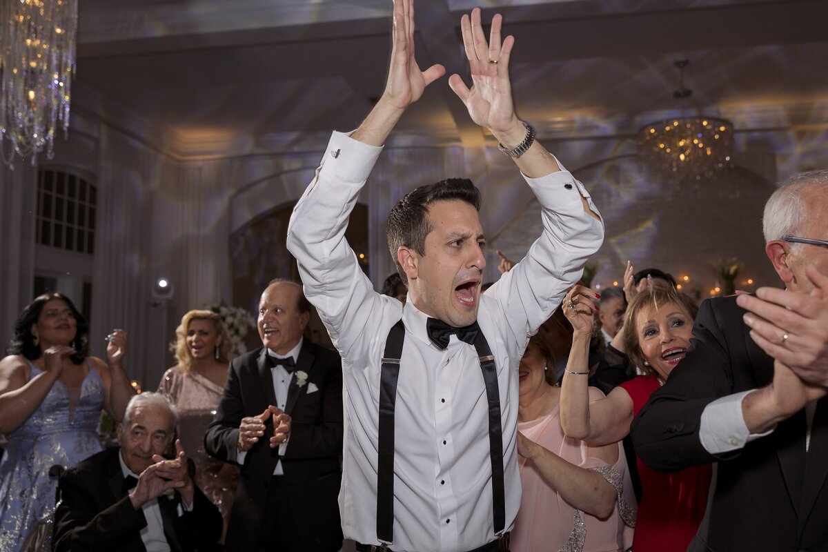 Guests enjoy the dance floor during wedding at Belle Mer Newport.