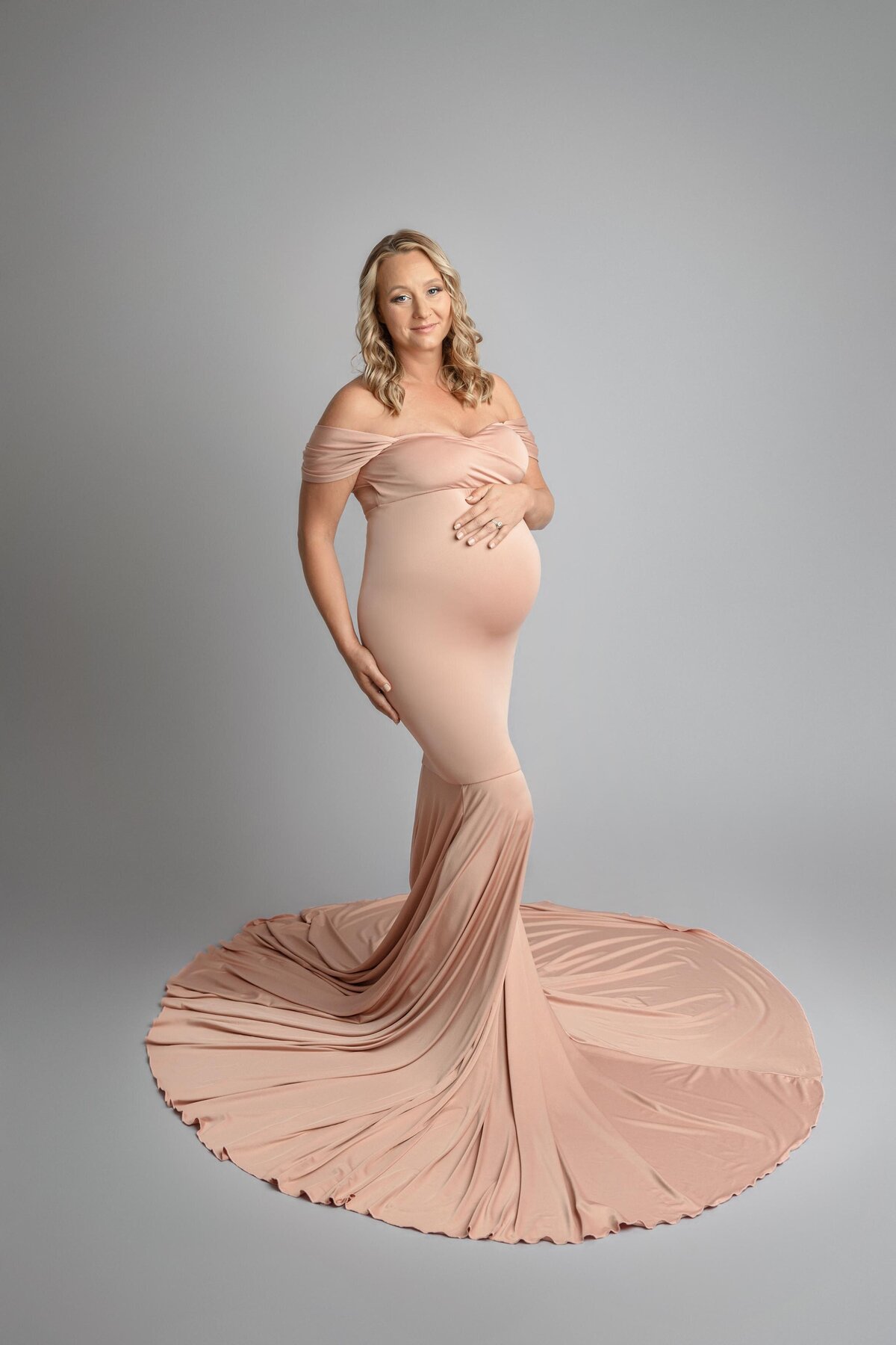 Expecting Mom In Pink Dress Draping on Ground Around Her