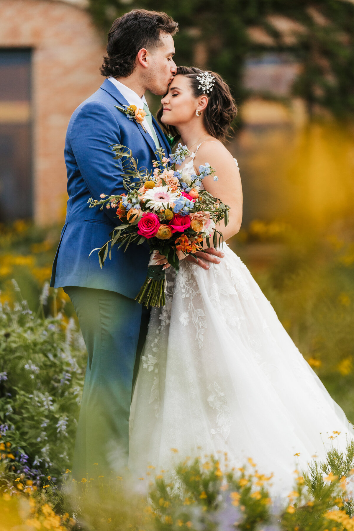groom-kisses-bride's-forehead