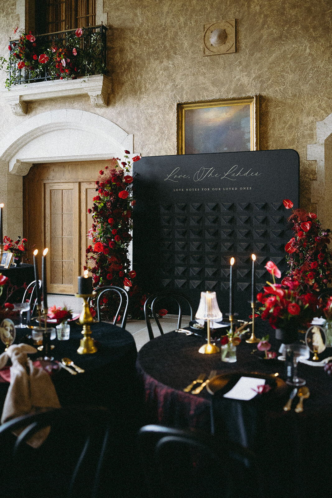Escort wall with black envelopes and love notes with guest table number and seating assignment