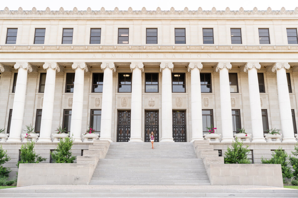 Texas A&M senior girl standing on stairs of Administration Building