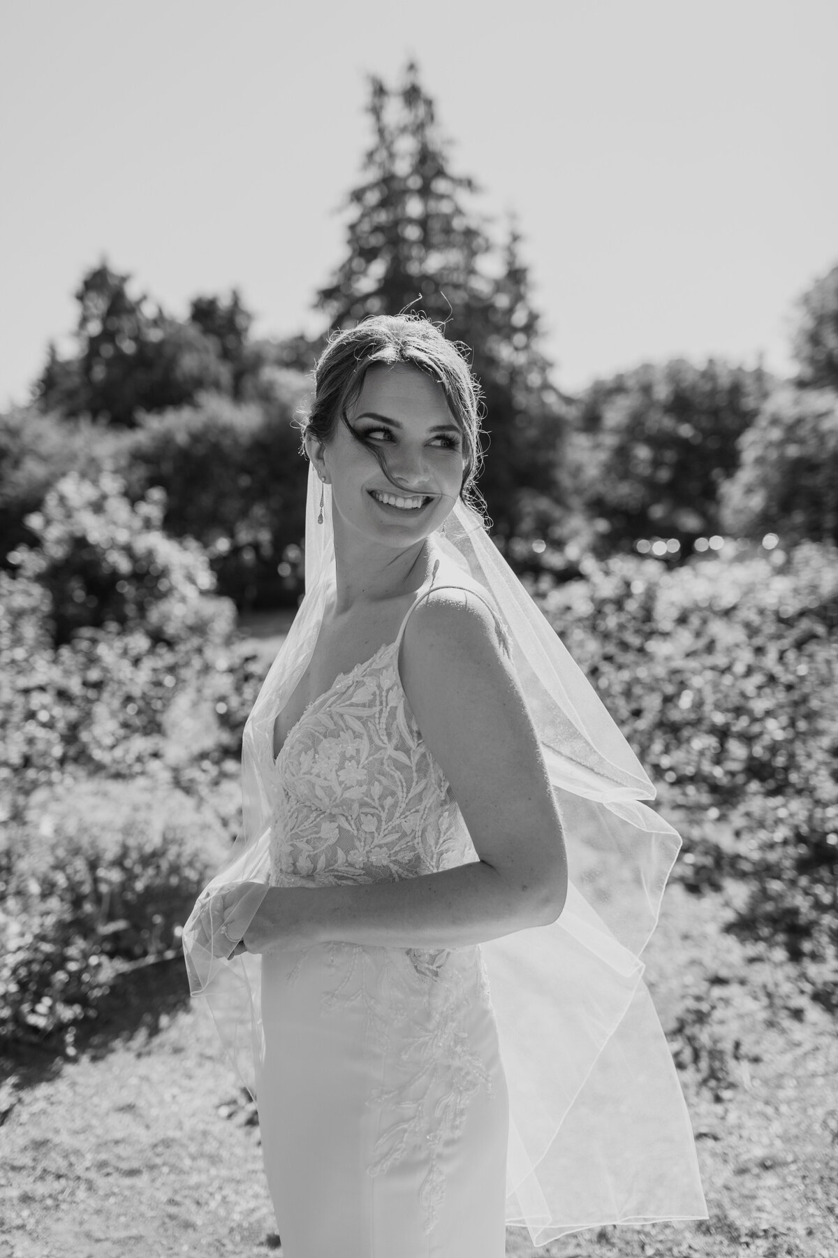 A stunning black & white portrait of a bride at the Woodland Park Zoo Rose Garden in Seattle. Captured by Fort Worth Wedding Photographer, Megan Christine Studio