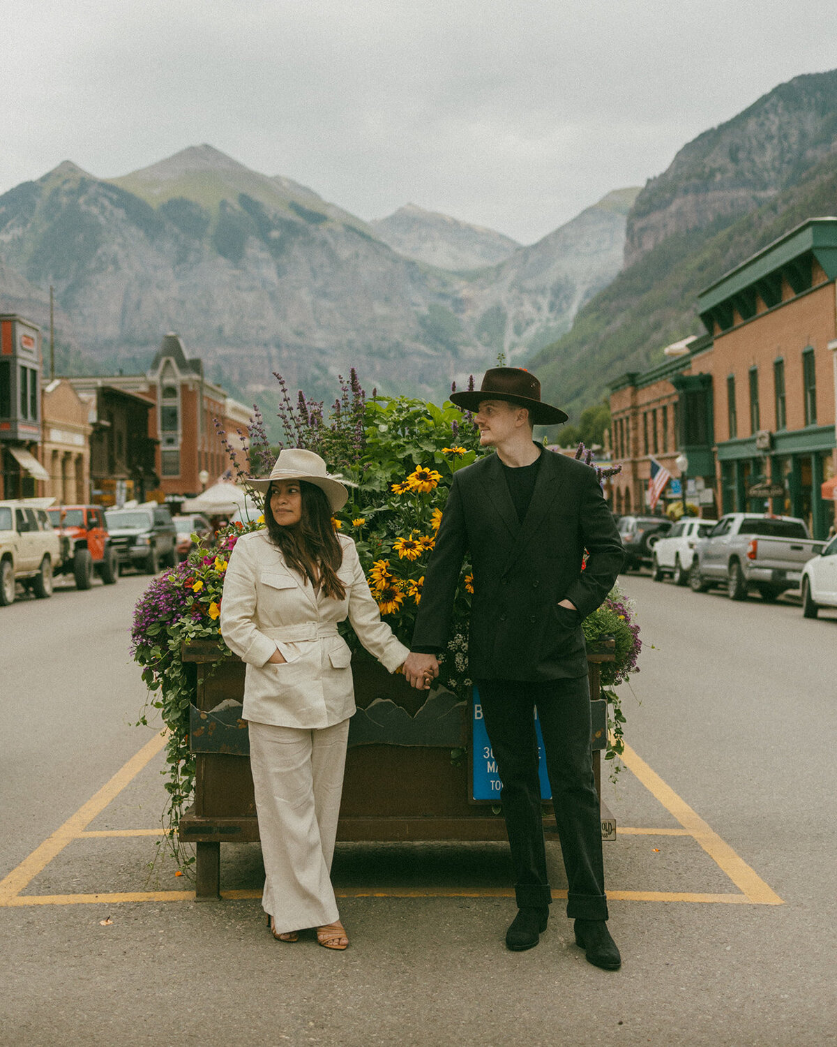 couple in Telluride Colorado on street in front of flowerbox