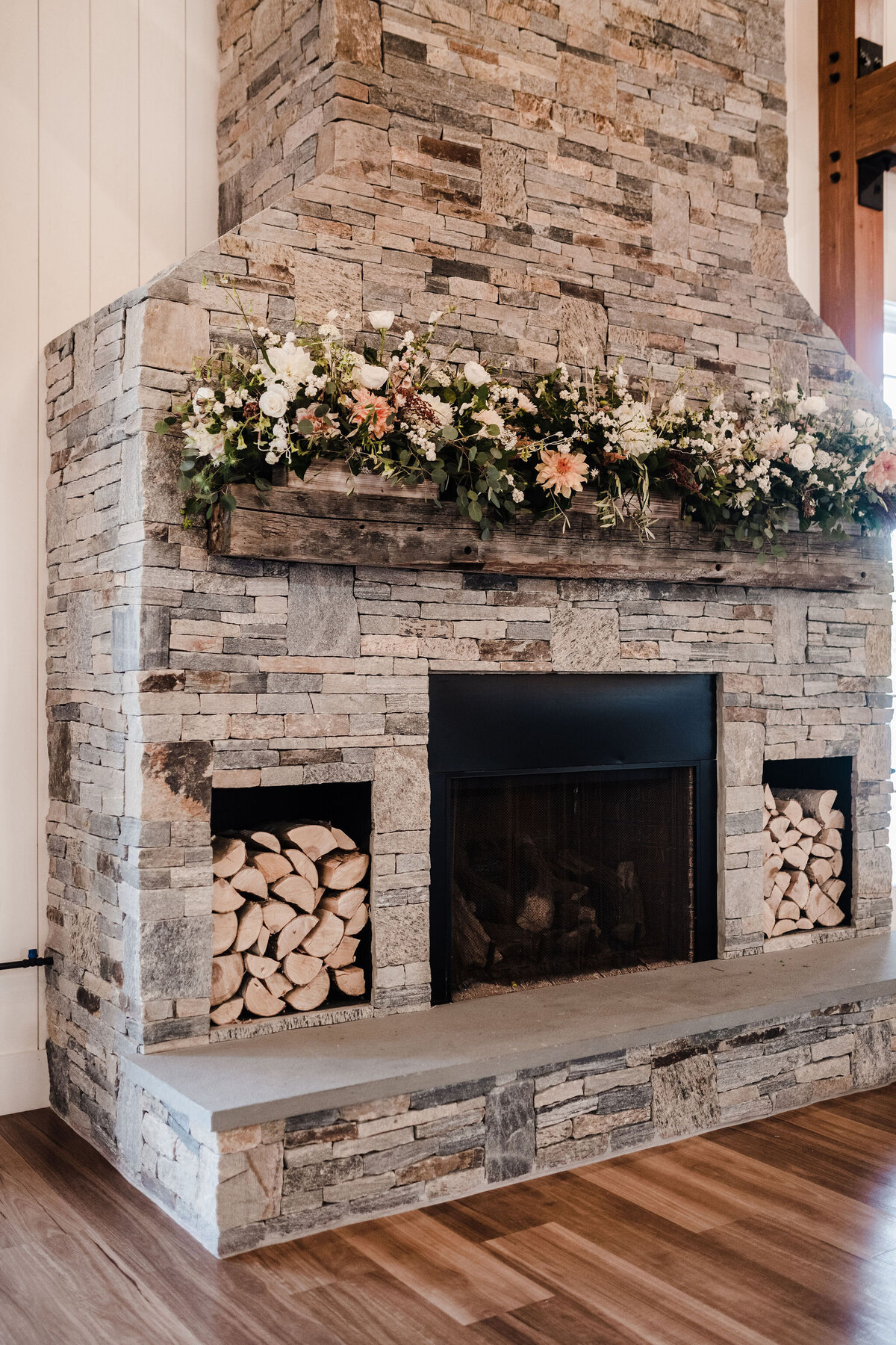 Stone fireplace with rust and  cream florals
